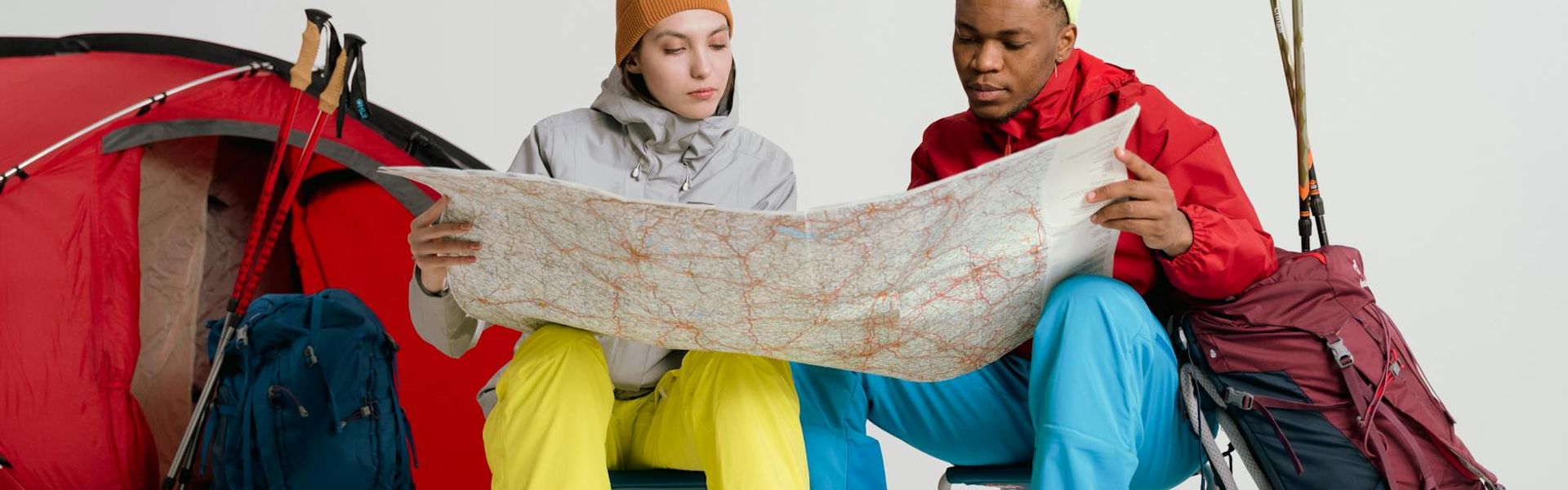 Person planning travel route on world map